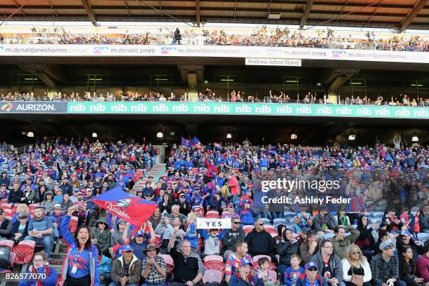 Knights fans support their team during the round 22 NRL match between the Newcastle Knights and the New Zealand Warriors at McDonald Jones Stadium on...