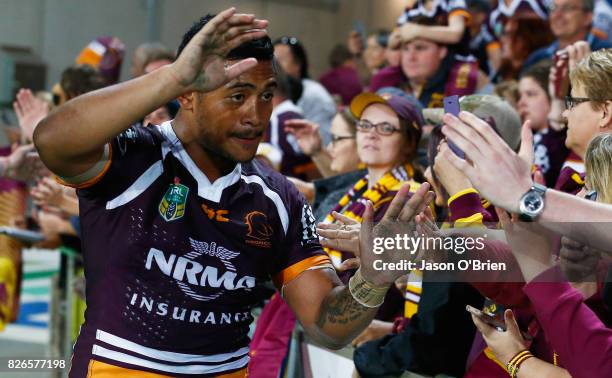 Anthony Milford of the Broncos celebrates with fans during the round 22 NRL match between the Gold Coast Titans and the Brisbane Broncos at Cbus...