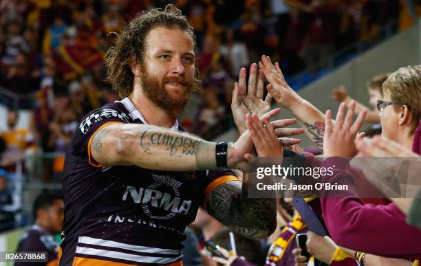 Korbin Sims of the Broncos celebrates with fans during the round 22 NRL match between the Gold Coast Titans and the Brisbane Broncos at Cbus Super...