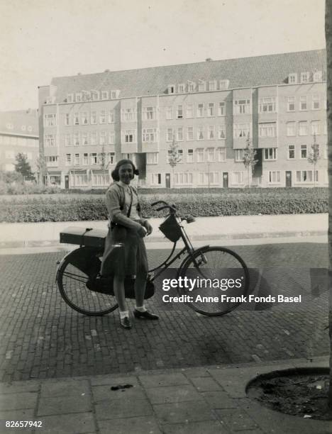 Margot Frank , sister of Anne Frank, cycling at Merwedeplein in Amsterdam, May 1939.