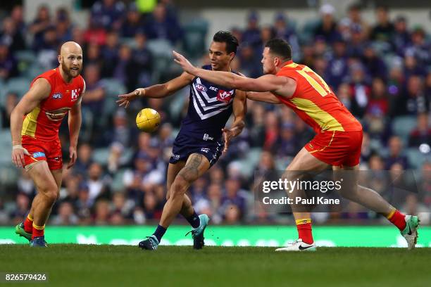 Danyle Pearce of the Dockers passes the ball during the round 20 AFL match between the Fremantle Dockers and the Gold Coast Suns at Domain Stadium on...