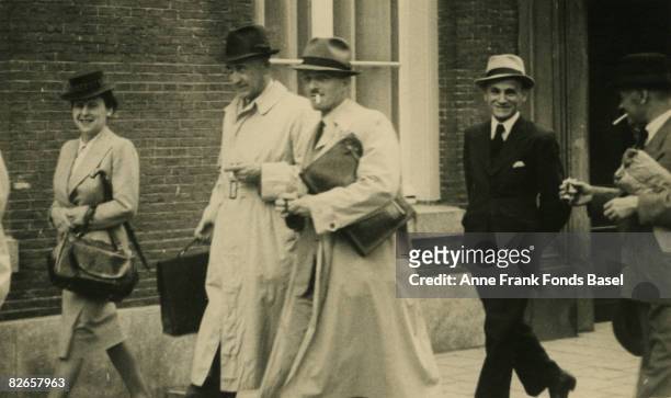 Guests on their way to the wedding of Miep and Jan Gies in Amsterdam, 16th July 1941. From left to right, Auguste van Pels , Hermann van Pels (1898 -...