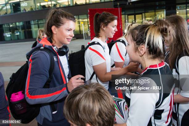 Abbie Scott and Sarah Hunter meet with fans and well wishers as the England Womens' Rugby team depart for the Rugby World Cup at Heathrow Airport on...
