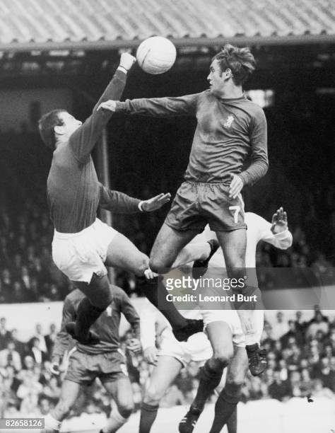 West Bromwich Albion goalkeeper Dick Sheppard punches the ball clear, preventing a header by Tommy Baldwin of Chelsea during a First Division match...