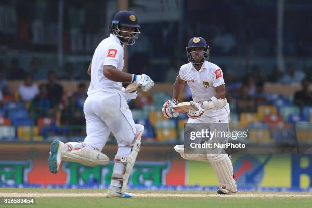 Sri Lankan cricketers Dimuth Karunaratne and Kusal Mendis run between the wickets for a single run during the 3rd Day's play in the 2nd Test match...