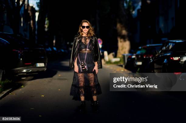 Model and fashion blogger Alexandra Lapp wearing a Self-Portrait lace dress in black, Perfecto leather biker Jacket from Schott NYC, studded punk...