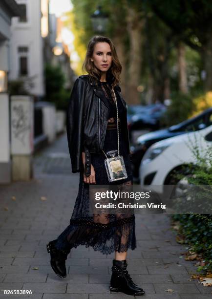 Model and fashion blogger Alexandra Lapp wearing a Self-Portrait lace dress in black, Perfecto leather biker Jacket from Schott NYC, studded punk...