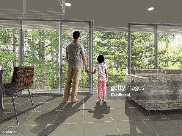 father and daughter looking out the w - リビング　家族　日本 ストックフォトと画像