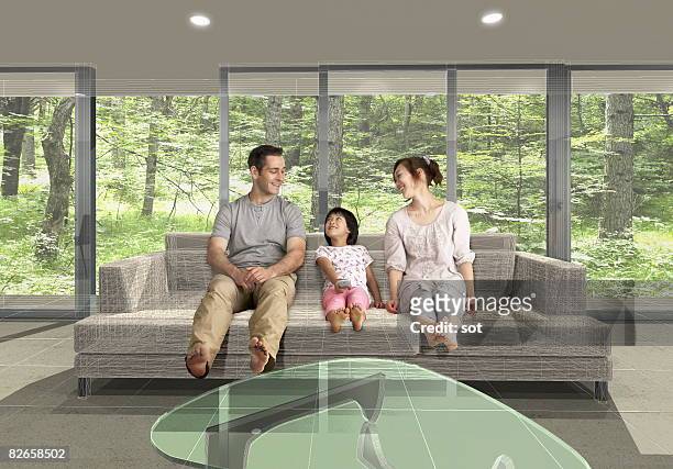 family talking on the sofa, smiling - bare feet male tree stock pictures, royalty-free photos & images