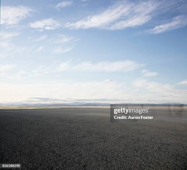 open empty parking lot - asfalt stockfoto's en -beelden