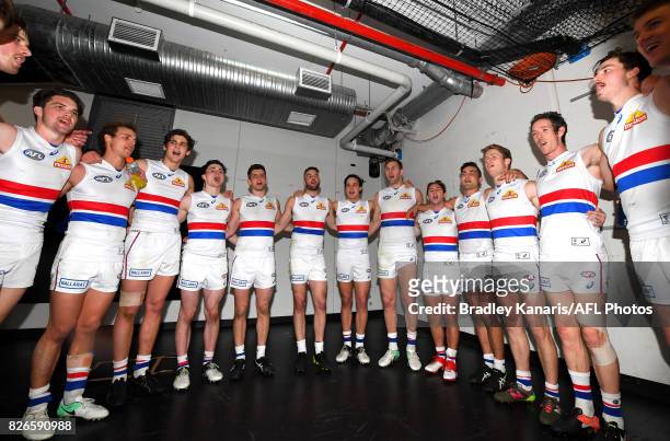 Bulldogs players celebrate victory after the round 20 AFL match between the Brisbane Lions and the Western Bulldogs at The Gabba on August 5, 2017 in...