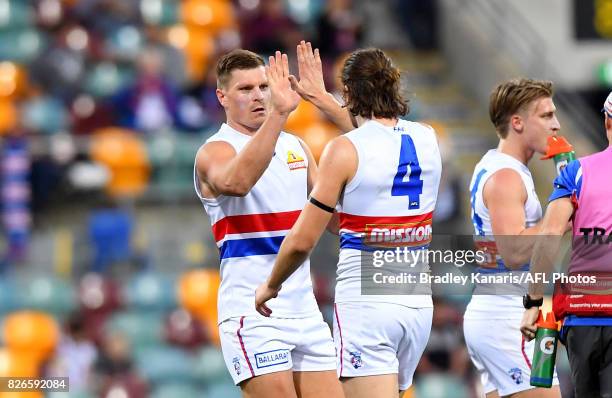 Jack Redpath of the Bulldogs celebrates a goal during the round 20 AFL match between the Brisbane Lions and the Western Bulldogs at The Gabba on...