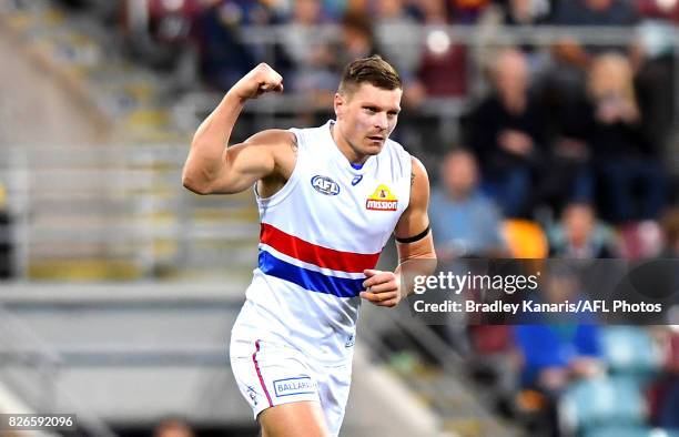 Jack Redpath of the Bulldogs celebrates a goal during the round 20 AFL match between the Brisbane Lions and the Western Bulldogs at The Gabba on...