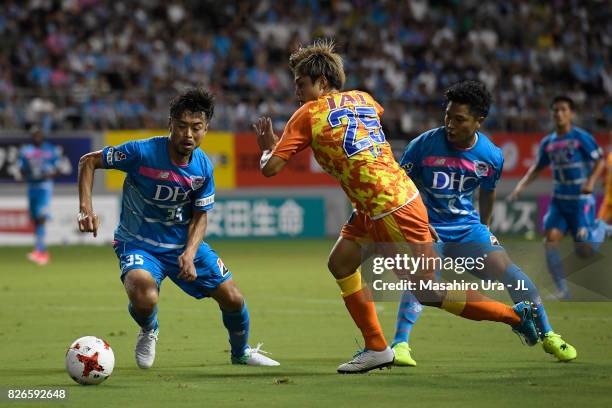 Ko Matsubara of Shimizu S-Pulse takes on Takeshi Aoki of Sagan Tosu during the J.League J1 match between Sagan Tosu and Shimizu S-Pulse at Best...