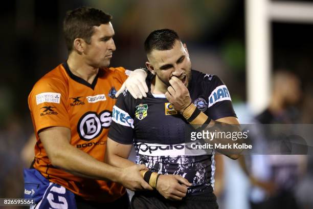 Jack Bird of the Sharks leaves the field with an injury during the round 22 NRL match between the Cronulla Sharks and the Canberra Raiders at...