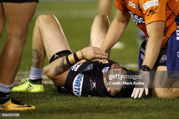 Jack Bird of the Sharks lies on the ground with an injury during the round 22 NRL match between the Cronulla Sharks and the Canberra Raiders at...