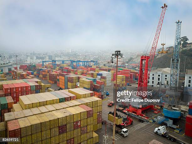 shipping containers stacked in the shipping yard - latin america economy stock pictures, royalty-free photos & images