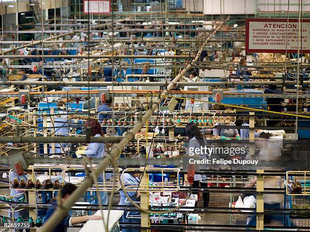 overview of a factory at work - sweatshop stock pictures, royalty-free photos & images