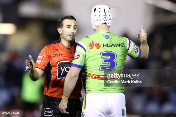 Referee Gerard Sutton speaks to Jarrod Croker of the Raiders during the round 22 NRL match between the Cronulla Sharks and the Canberra Raiders at...