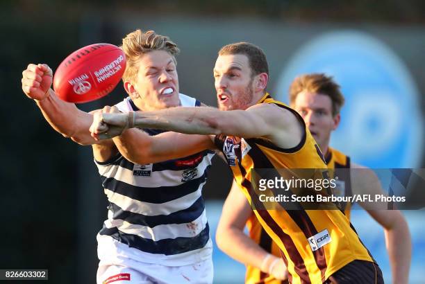 Kurt Heatherley of Box Hill Hawks and Rhys Stanley of the Geelong Cats compete for the ball during the round 16 VFL match between the Box Hill Hawks...