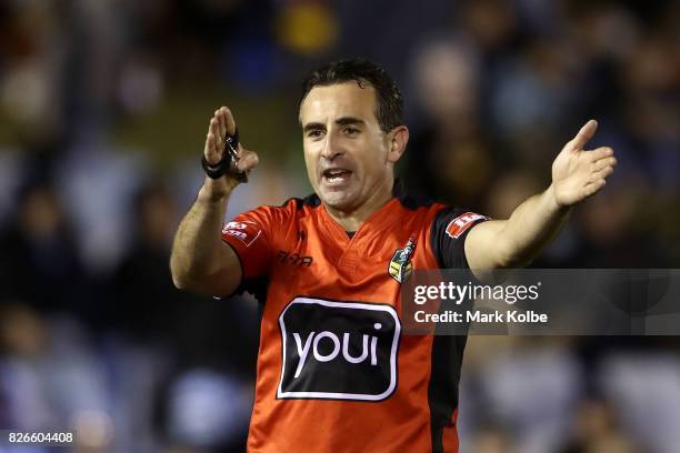 Referee Gerard Sutton awards a penalty during the round 22 NRL match between the Cronulla Sharks and the Canberra Raiders at Southern Cross Group...