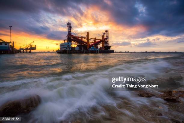 low angle view of container ship on sea - ship bow wake stock pictures, royalty-free photos & images