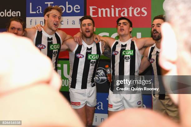 Tom Langdon, Ben Reid, Jeremy Howe, Brayden Maynard and Steele Sidebottom of the Magpies sing the song in the rooms after winning the round 20 AFL...