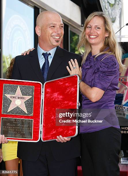 Comedian Howie Mandel and wife Terry Soil pose with Mandel's star on the Hollywood Walk of Fame on September 4, 2008 in Los Angeles, California.