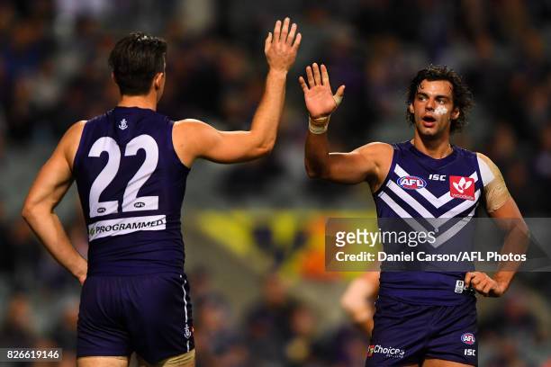 Shane Kersten and Brady Grey of the Dockers celebrates a goal during the 2017 AFL round 20 match between the Fremantle Dockers and the Gold Coast...