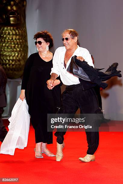 Director Adriano Celentano and Claudia Mori attend the Yuppi Du premiere at the Sala Grande during the 65th Venice Film Festival on September 4, 2008...