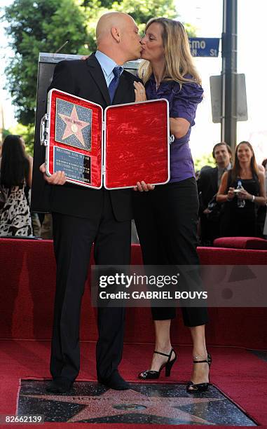 Howie Mandel, host of TV show "Deal or No Deal" on NBC kisses his wife Terry, after he received a star on the Hollywood Walk of Fame, September 05,...