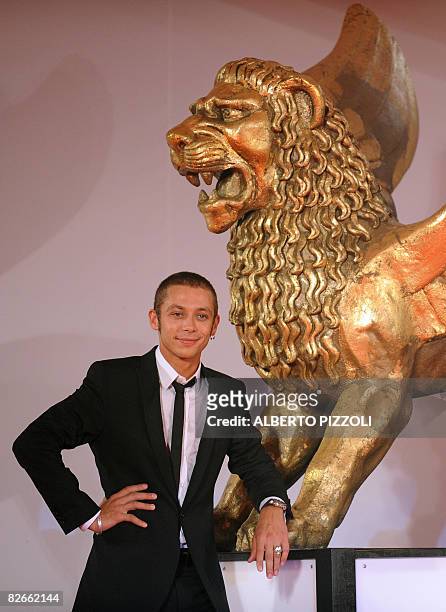 Italy's MotoGP rider Valentino Rossi poses before the screening of the movie "Yuppi Du" at the 65th Venice International Film Festival in Venice Lido...