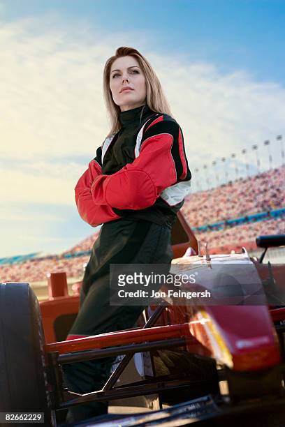 female racecar driver resting - pilota di auto da corsa foto e immagini stock