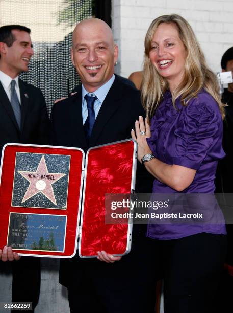 Comedian Howie Mandel and wife Terry Soil pose with Mandel's star on the Hollywood Walk of Fame on September 4, 2008 in Hollywood, California.