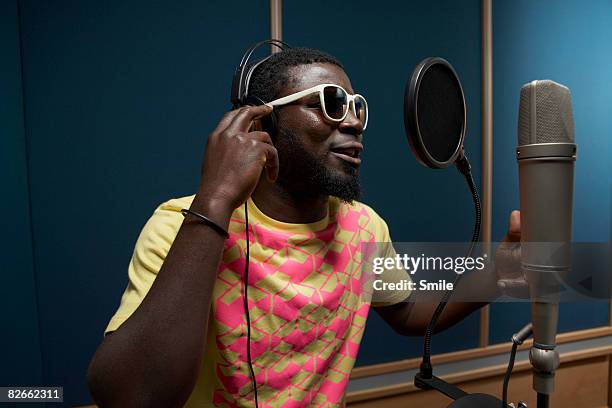 singer in recording studio - recording studio stock pictures, royalty-free photos & images