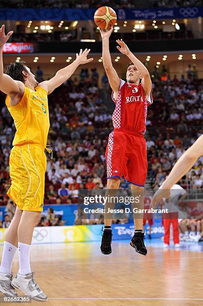 Marko Tomas of Croatia shoots over Andrew Bogut of Australia during the day 2 preliminary game at the Beijing 2008 Olympic Games in the Beijing...