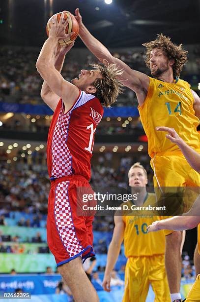 Sandro Nicevic of Croatia goes to the basket past Matt Nielsen of Australia during the day 2 preliminary game at the Beijing 2008 Olympic Games in...