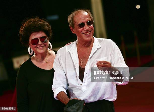 Director and actor Adriano Celentano with his wife Claudia Mori attend the 'Yuppi Du' premiere during the 65th Venice Film Festival on September 4,...