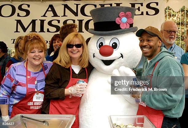 Actors Patrika Darbo and Bonnie Hunt, Mr. Snowman and musician Kevin Eubanks attend the "Thanksgiving Day Meal" for the homeless at the Los Angeles...