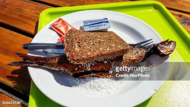 Portion of the traditionally smoked in Bornholm way herring called Sol of the Gudhjem or Bornholmer is seen on 1 August 2017 in Svaneke , Bornholm...