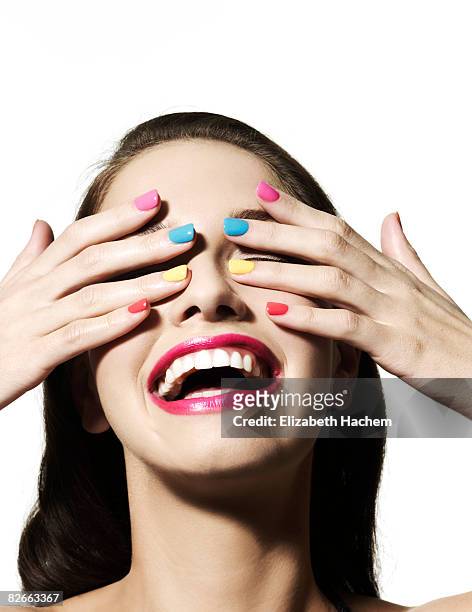 girl with hands over her eyes - nail varnish stockfoto's en -beelden