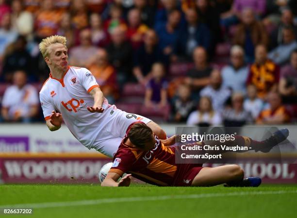 Blackpool's Mark Cullen is tackled by Bradford City's Matthew Kilgallon during the Sky Bet League One match between Bradford City and Blackpool at...