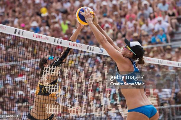 Lauren Fendrick of the United States blocks the ball during the gold medal match against Laura Ludwig and Kira Walkenhorst of Germany at FIVB Beach...