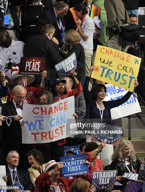 Signs are held up in the bleechers as US Representative Mary Fallin from Oklahoma speaks during the Republican National Convention 2008 at the Xcel...