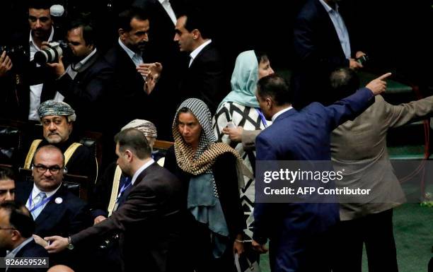 Oman's Minister of Heritage and Culture Haitham bin Tariq Al Said sits as EU foreign policy chief Federica Mogherini arrives for the swearing in of...