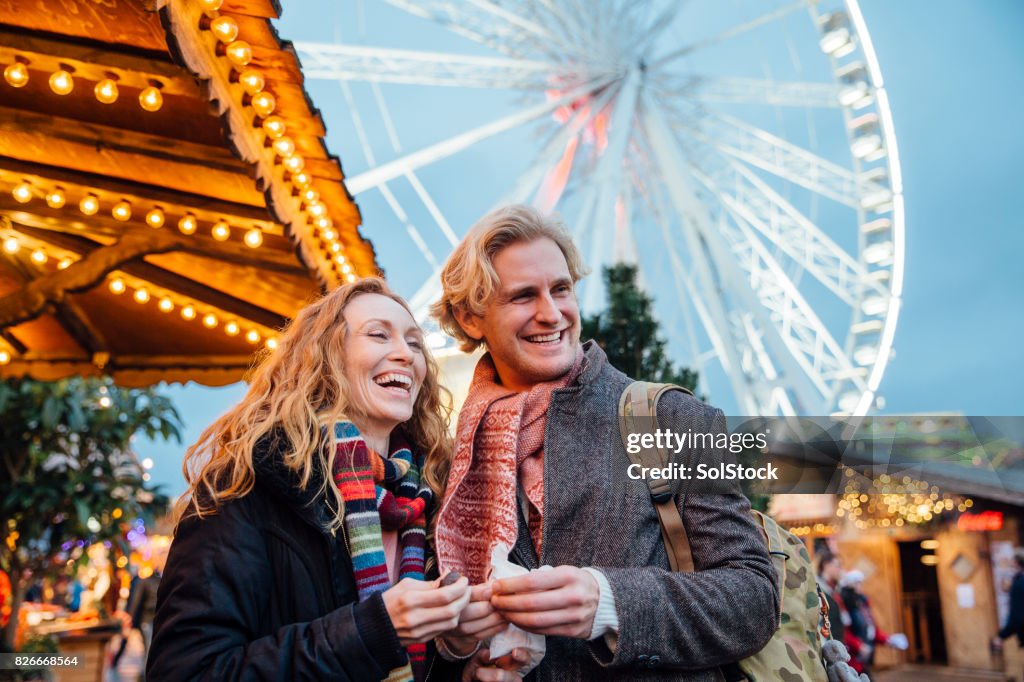 Couple Enjoying Christmas Fair