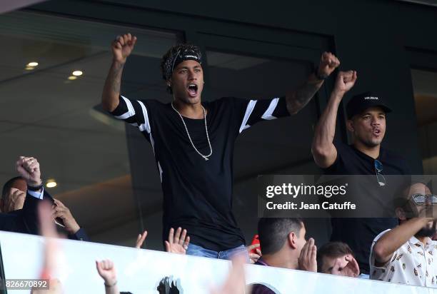 Neymar Jr of PSG celebrates the goal of Edinson Cavani during the French Ligue 1 match between Paris Saint Germain and Amiens SC at Parc des Princes...