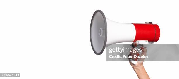 woman using megaphone with copy space - loudspeaker stock pictures, royalty-free photos & images