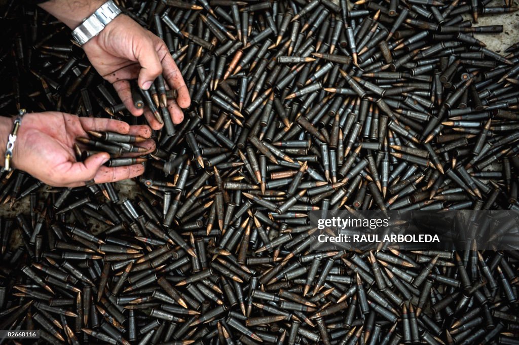 A Colombian police officer shows seized