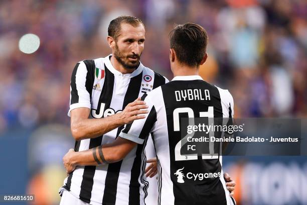 Giorgio Chiellini and Paulo Dybala of Juventus in action during the International Champions Cup match between Juventus and Barcelona at MetLife...